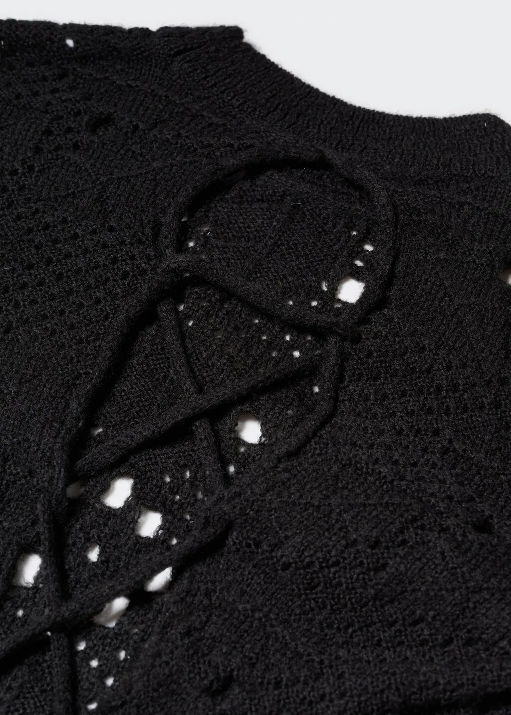 Pullover traforato schiena scoperta